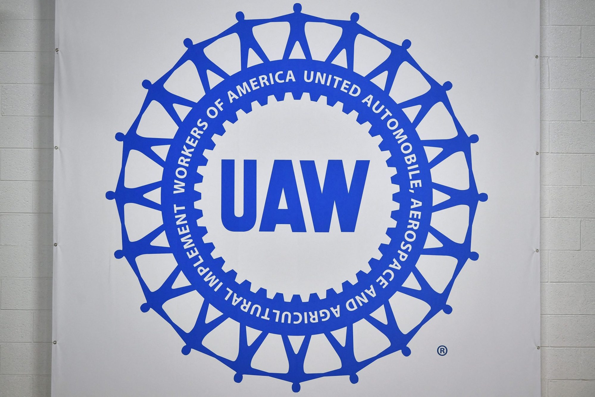 The logo of the United Auto Workers union is seen during a tour of the General Motors Factory ZERO electric vehicle assembly plant in Detroit, Michigan on November 17, 2021. Photo by MANDEL NGAN/AFP via Getty Images