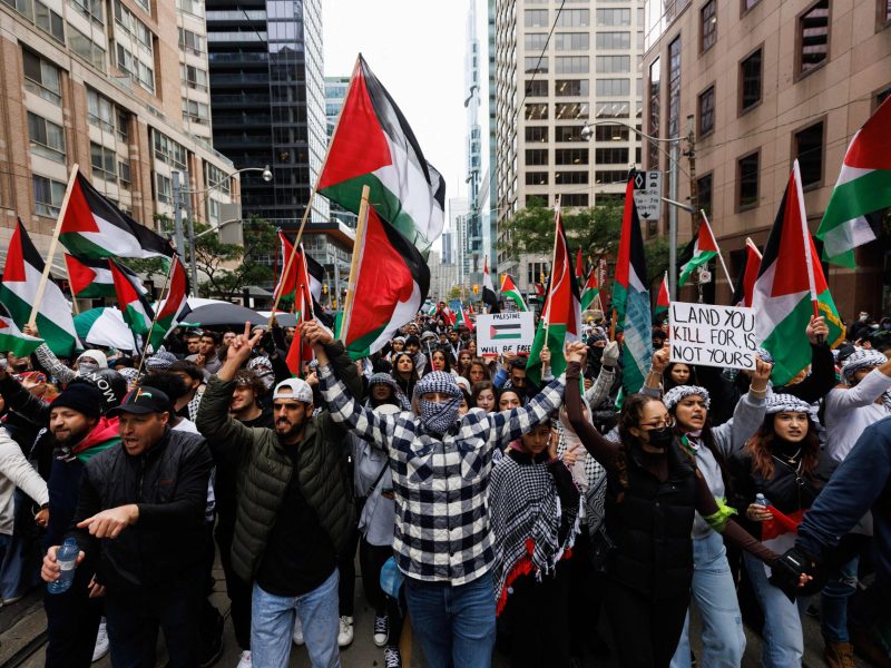 Demonstrators in support of Palestinians wave Palestinian flags during a protest in Toronto, Ontario, Canada, on October 9, 2023.