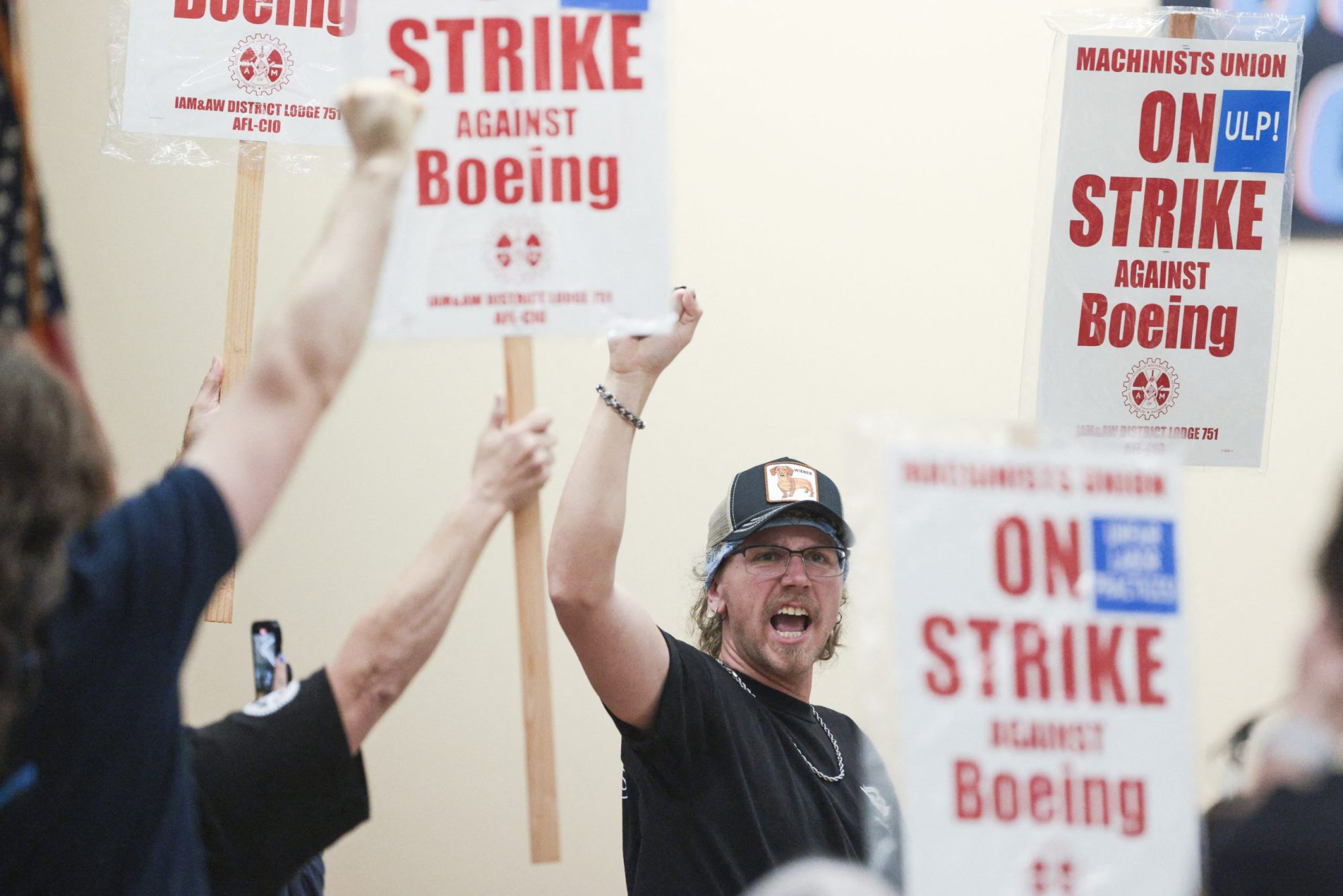 Union members react as Aerospace Machinists District 751 President Jon Holden announces that union members rejected a proposed Boeing contract and will go on strike, following voting results at their union hall in Seattle, Washington, on September 12, 2024. Photo by JASON REDMOND/AFP via Getty Images