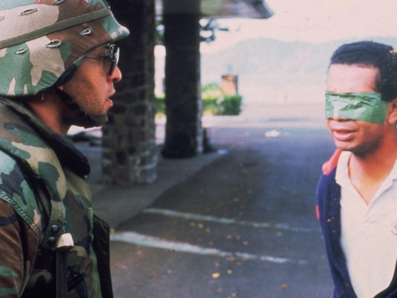 An American soldier stands in the street with a blindfolded Panamanian prisoner during the United States invasion, 'Operation Just Cause,' to oust Panamanian leader General Manuel Noriega. Photo by Consolidated News Pictures/Getty Images