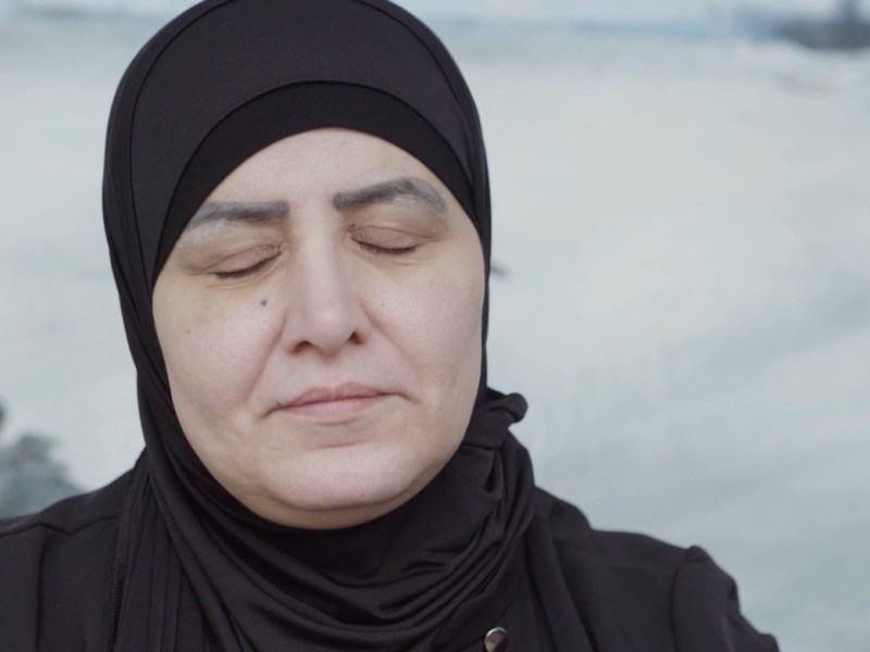 A woman in the West Bank closes her eyes during an interview for Palestine Remembers, a forthcoming documentary from Shadowgraph