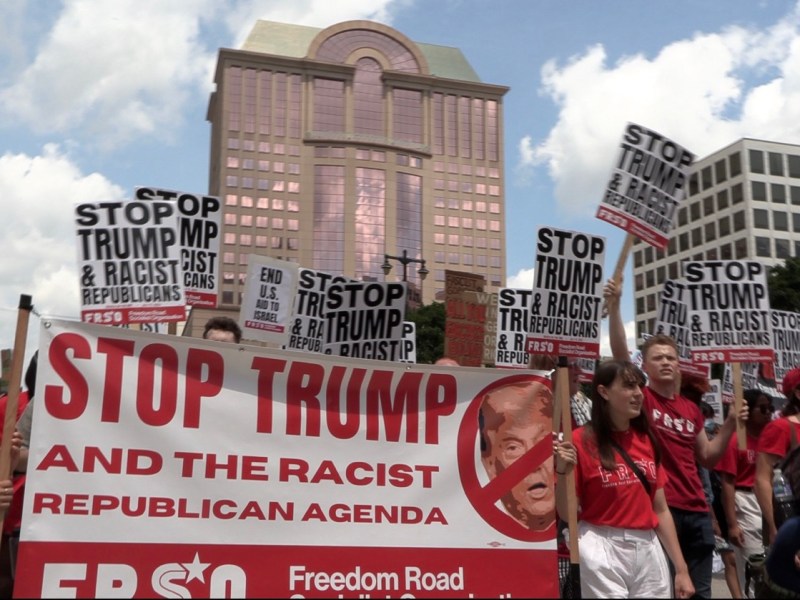 Dozens of members of the Freedom Road Socialist Organization join a protest march in downtown Milwaukee, WI, on Monday, July 15, as the 2024 Republican National Convention begins. Protestors hold signs with slogans such as "Stop Trump and the racist Republican agenda." Photo by Stephen Janis.